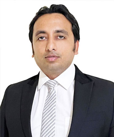 Portrait of Mr. Digant Sharma, Founder and Chairman, in a dark suit and tie